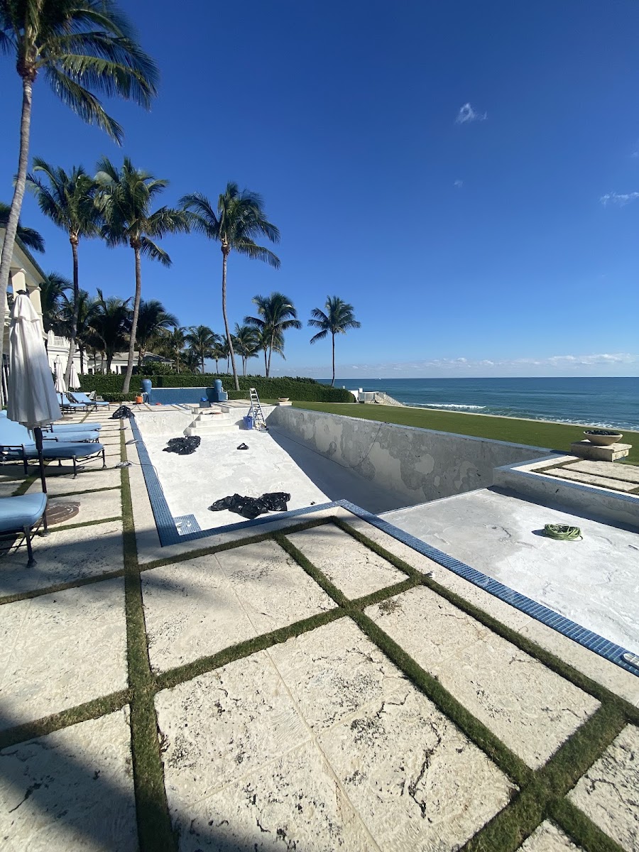 Large drained pool renovation at an oceanfront property